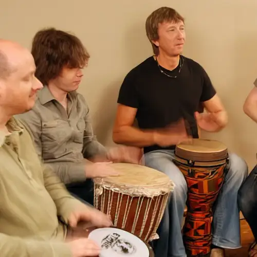 students learning djembe